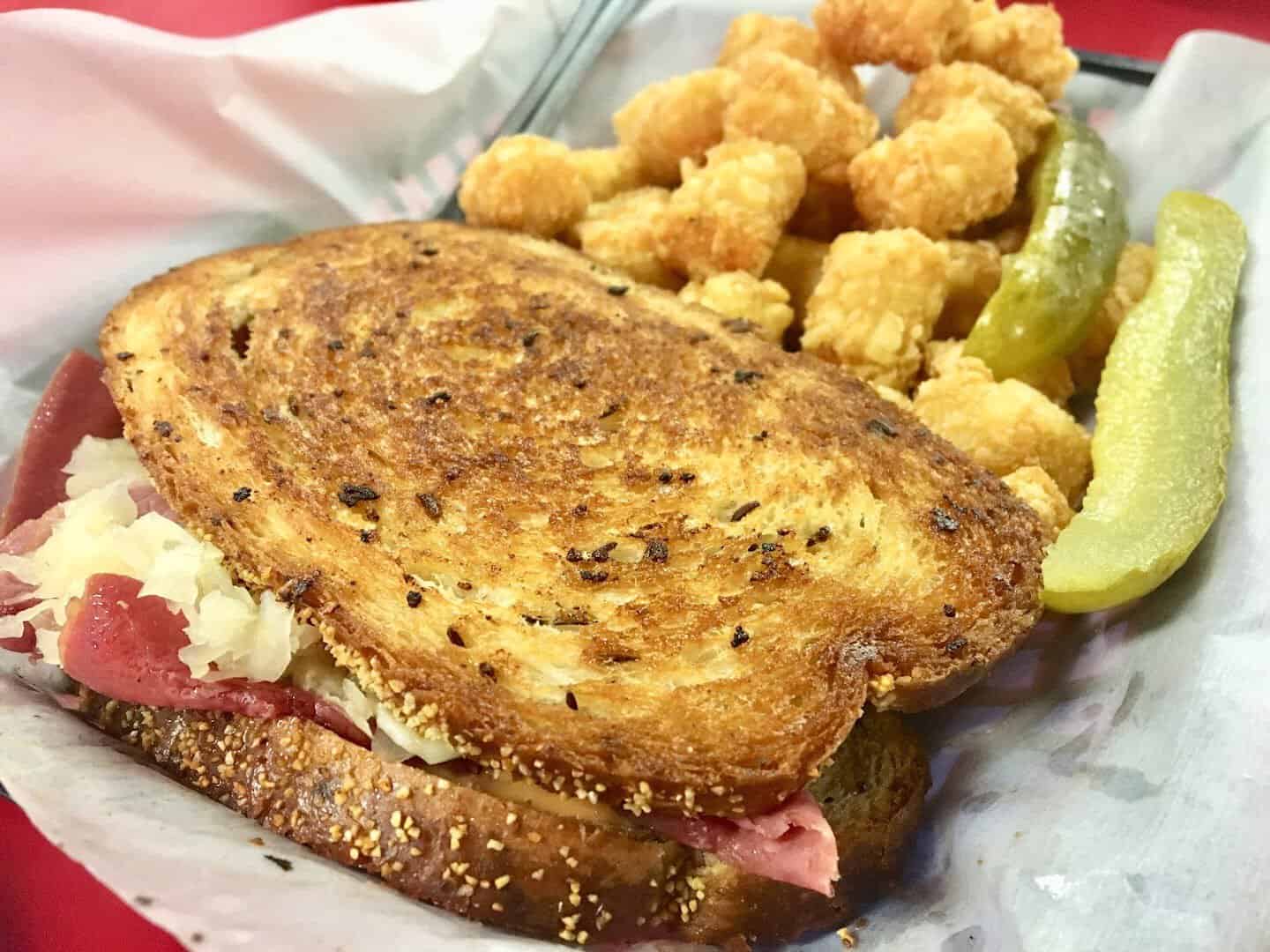Grilled Reuben sandwich with fried sides at the Runaway Train Cafe in Brownwood, Texas