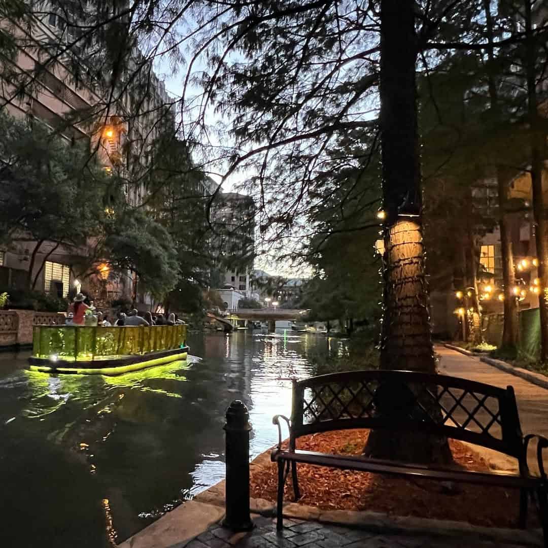 San Antonio River Walk lit at dusk with a lantern-lit barge, San Antonio, Texas