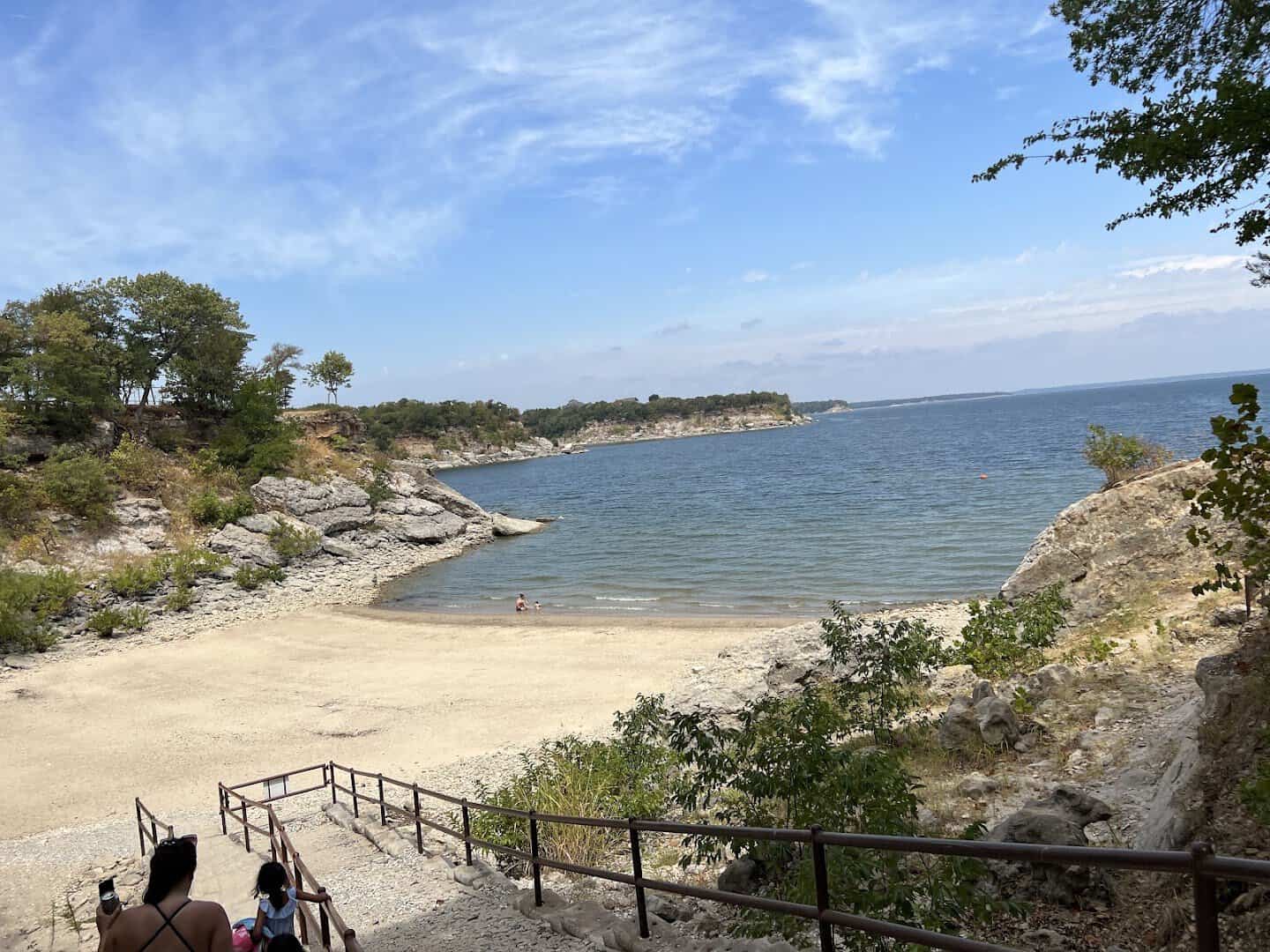 Sandy swimming cove and stairs down to the water at Eisenhower State Park