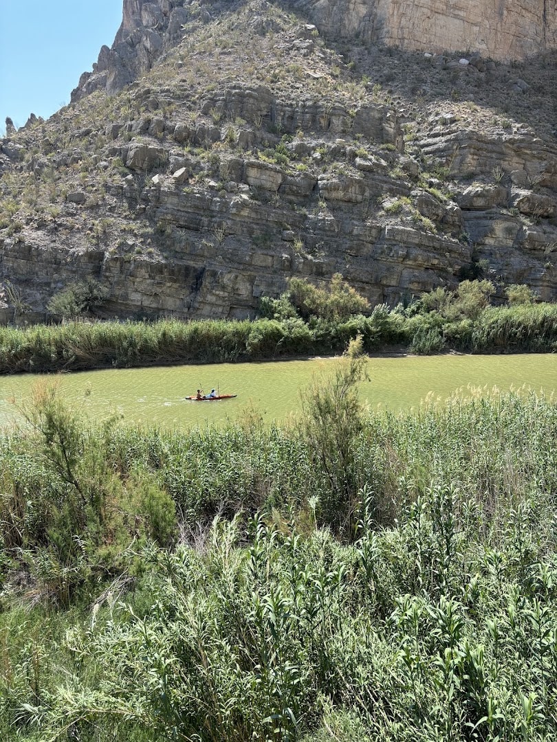 Santa Elena Canyon walls above the green banks of the Rio Grande