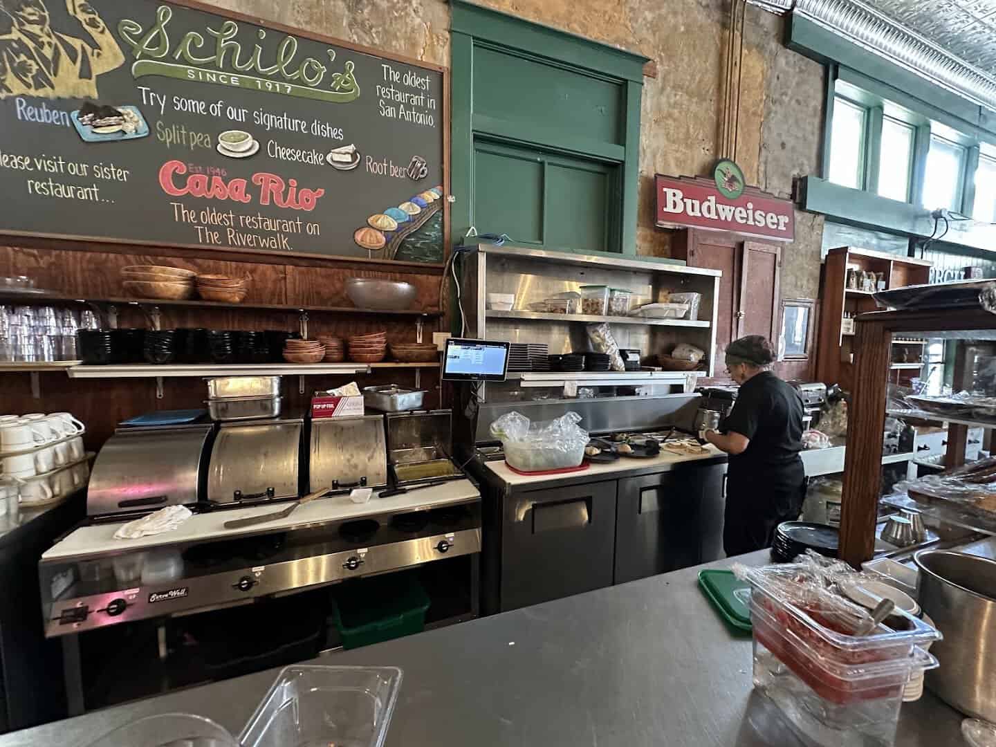 Deli counter and signature dishes board at Schilo's in San Antonio