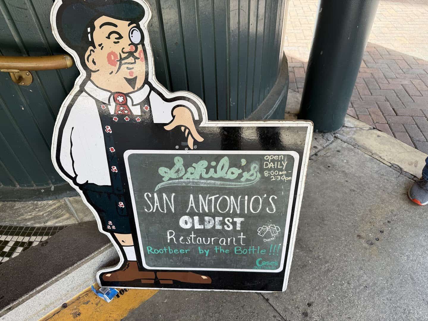 Papa Fritz cutout sign reading San Antonio's oldest restaurant at Schilo's