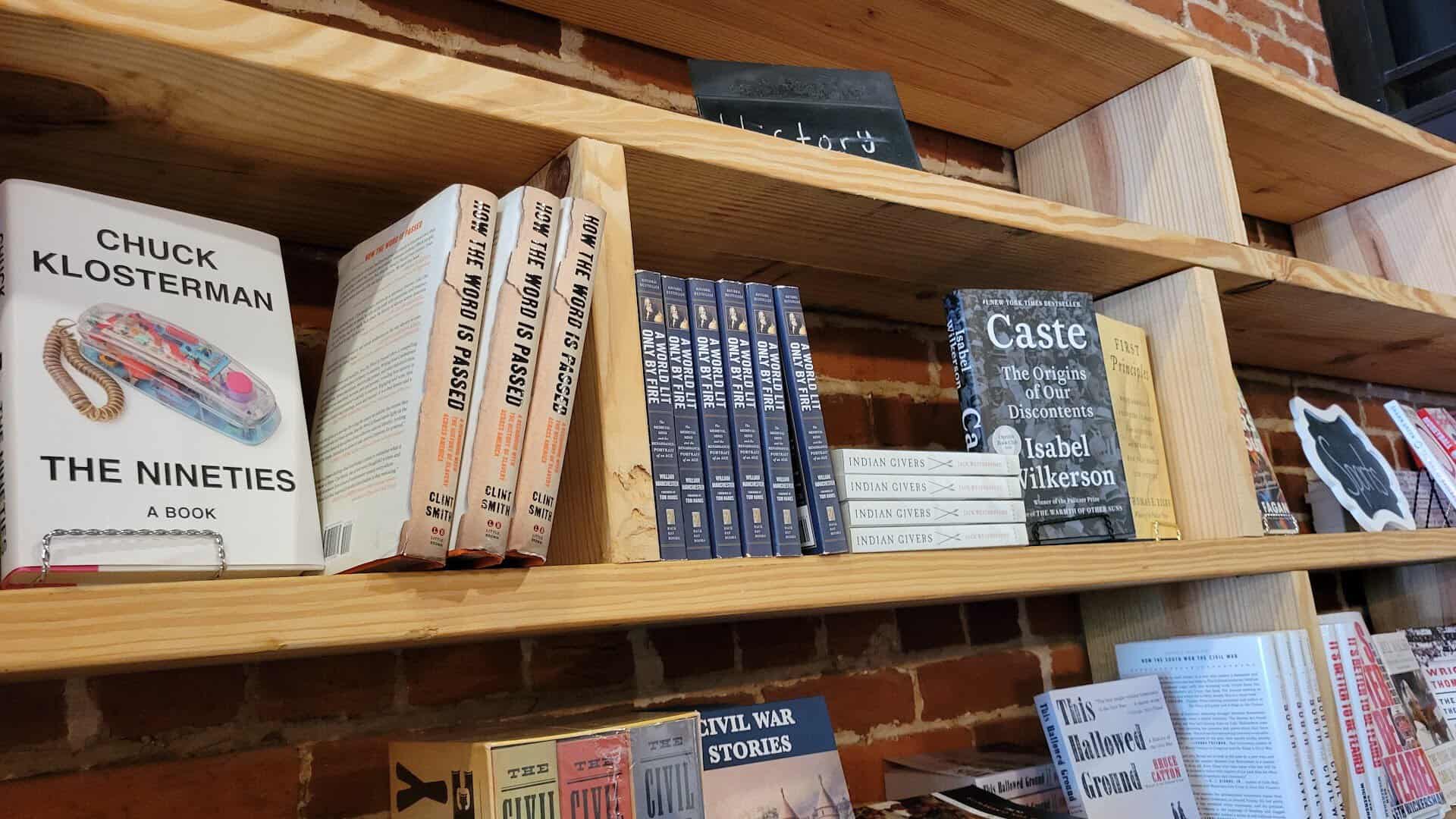 Shelves of science fiction and literary books at The Painted Porch Bookshop in Bastrop, Texas