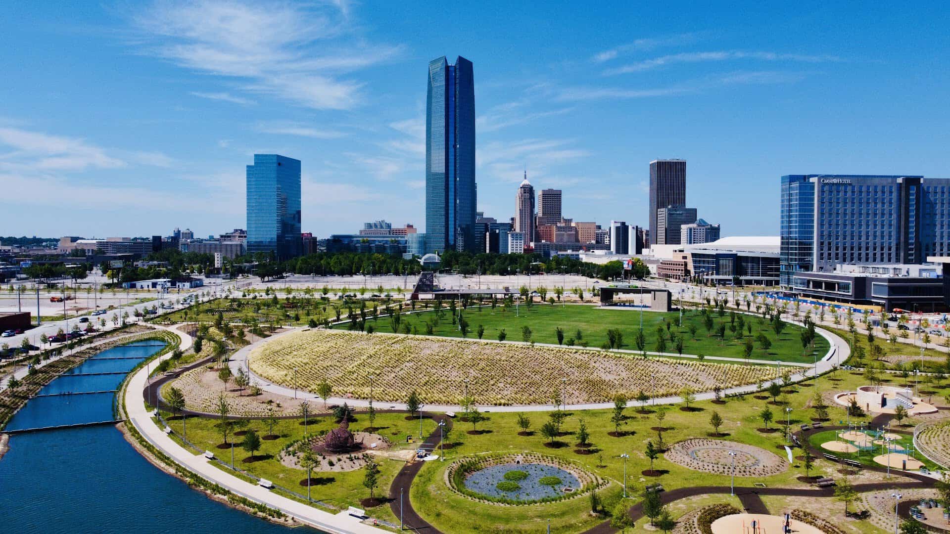 Aerial view of the oval lawn and downtown skyline at Scissortail Park in Oklahoma City