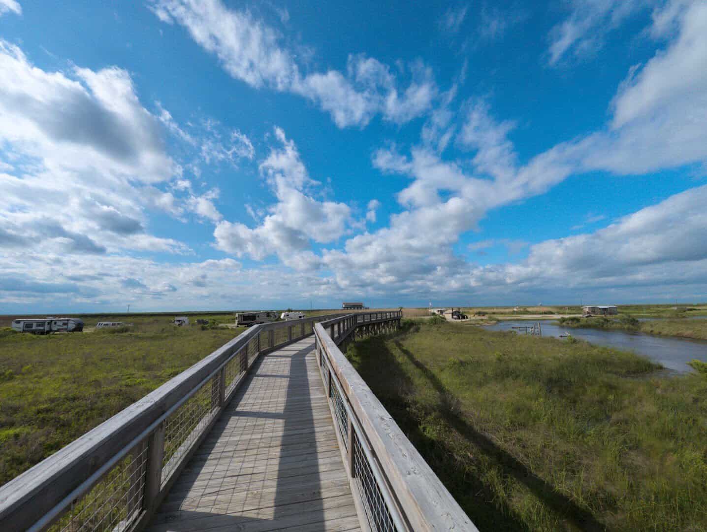 Boardwalk winding through the coastal marsh at Sea Rim State Park near Sabine Pass, Texas