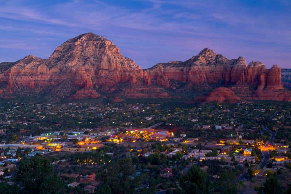 Red rock formations glowing above Sedona at dusk, Sedona, Arizona