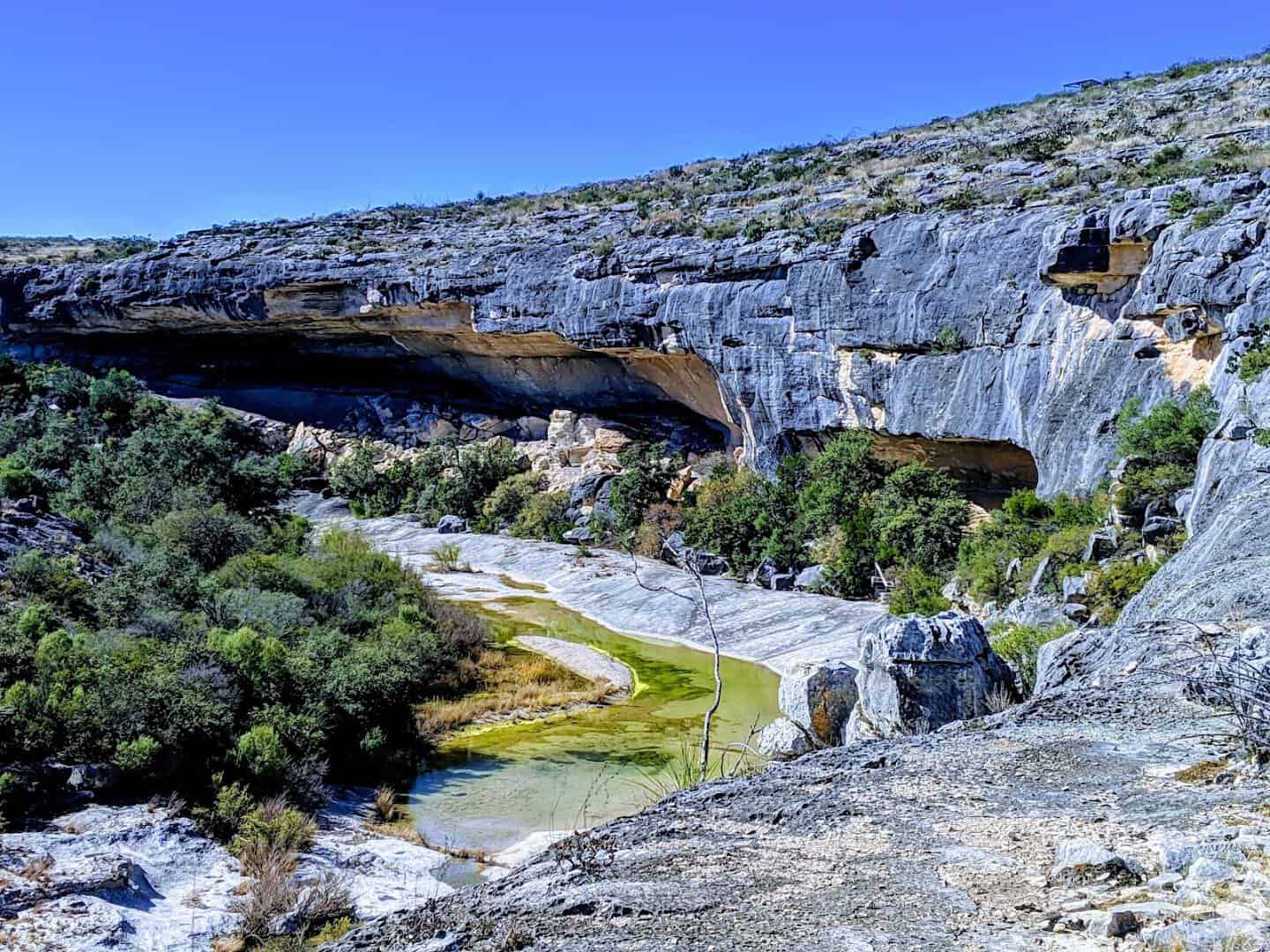 Limestone canyon overhang above a river bend at Seminole Canyon State Park in West Texas
