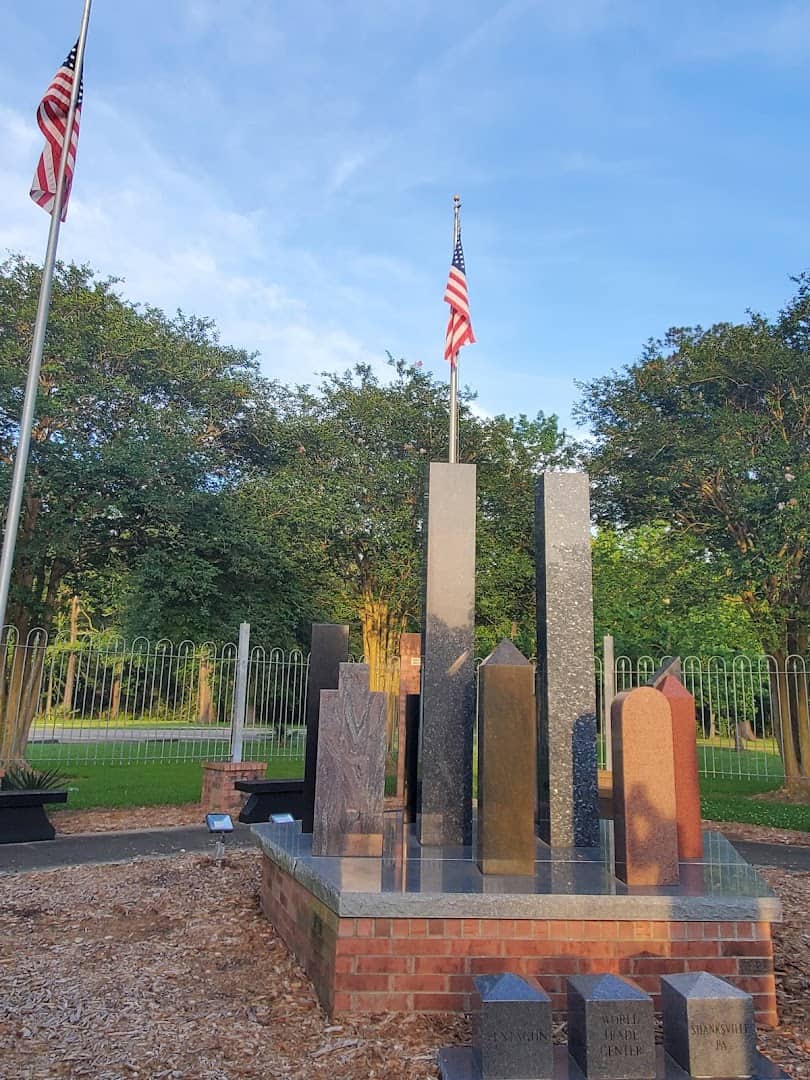 September 11 memorial with steel beams and flags at Beaumont Botanical Gardens