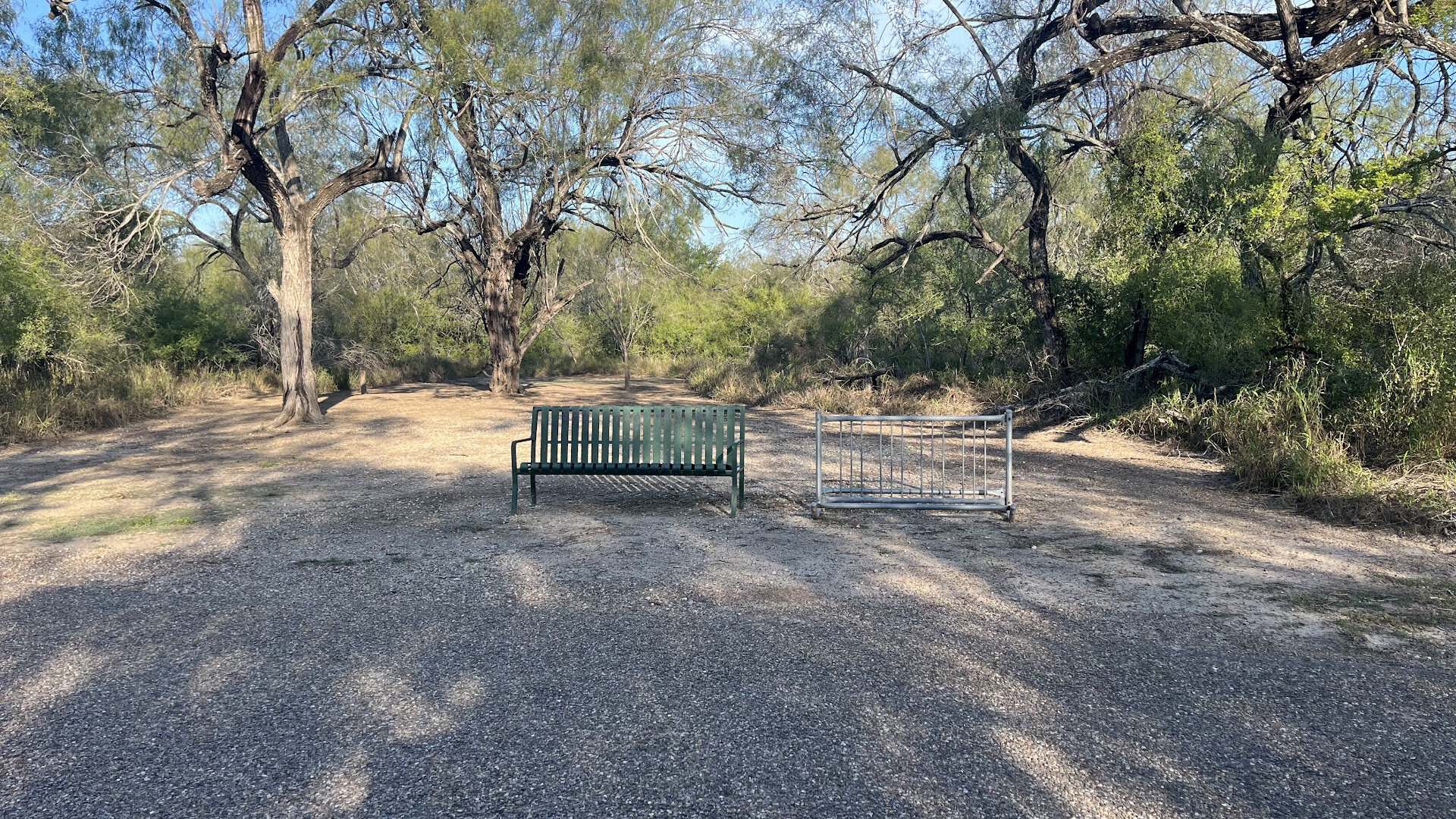 A shaded nature trail with a bench at Bentsen-Rio Grande Valley State Park