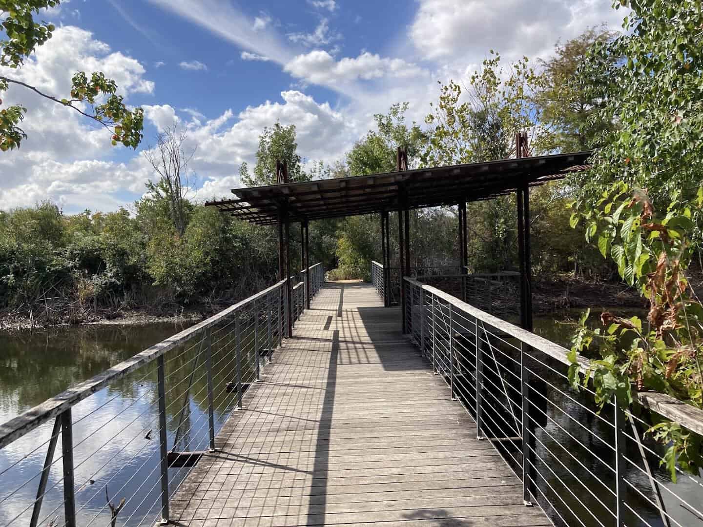 Boardwalk stretching over the water at Sheldon Lake State Park in Houston, Texas
