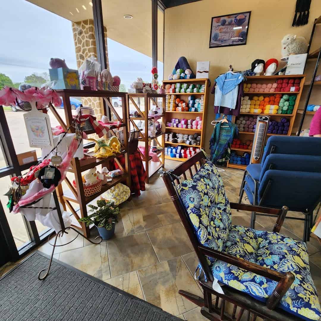 The seating area and yarn shelves inside Lone Star Yarn in Bedford, Texas