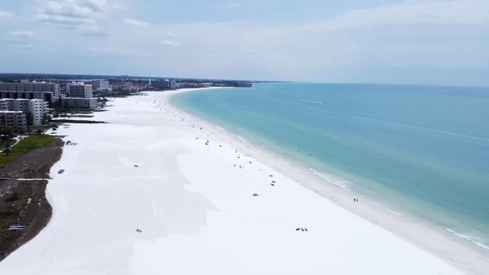 Aerial view of the white sand and turquoise water at Siesta Beach, Florida