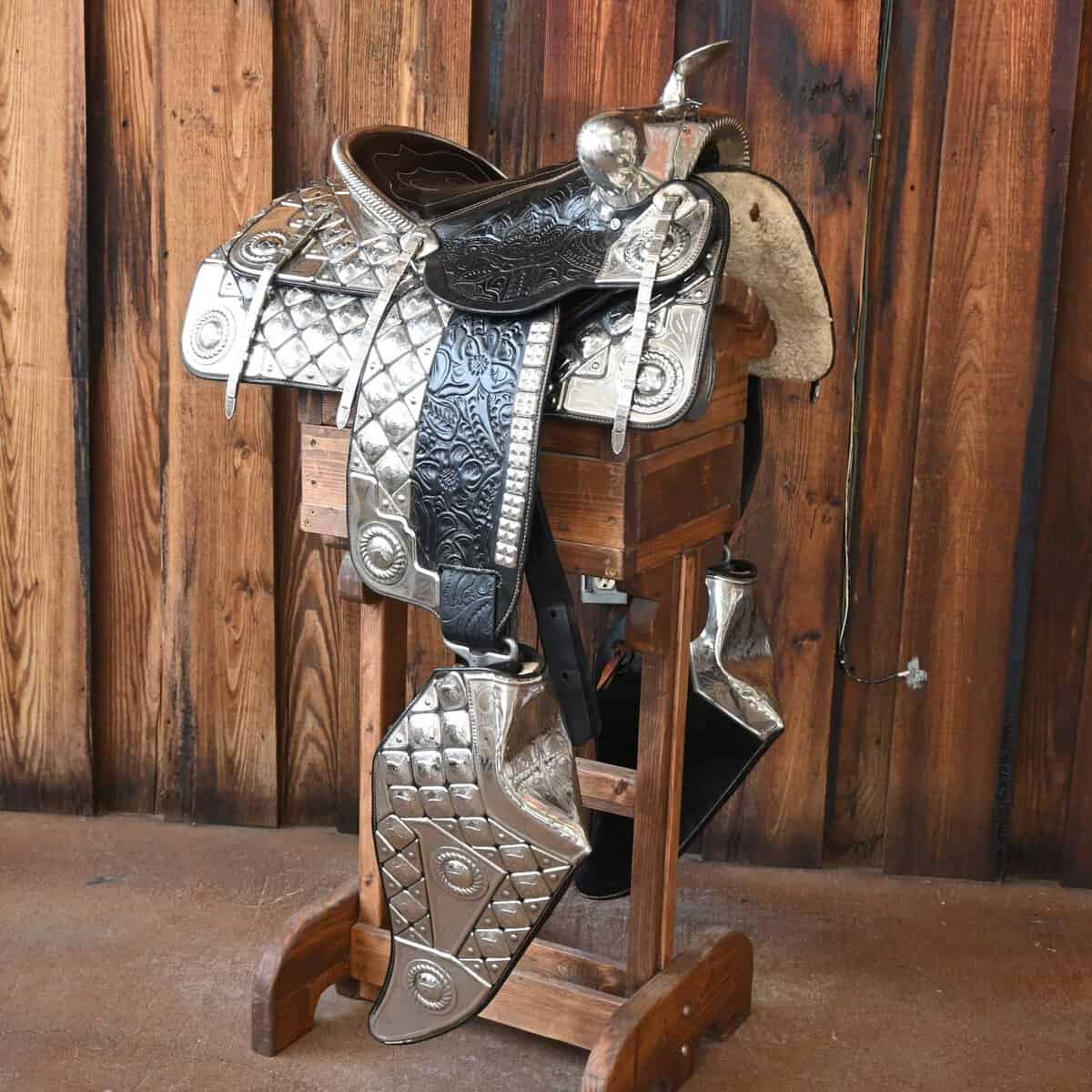 Ornate silver-mounted show saddle on a stand at Teskey's in Weatherford, Texas