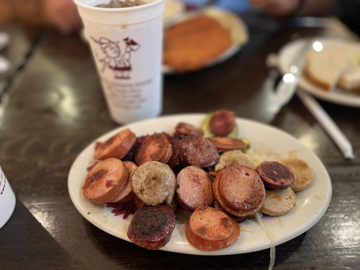 Plate of sliced house-made sausages at Kuby's Sausage House in Dallas