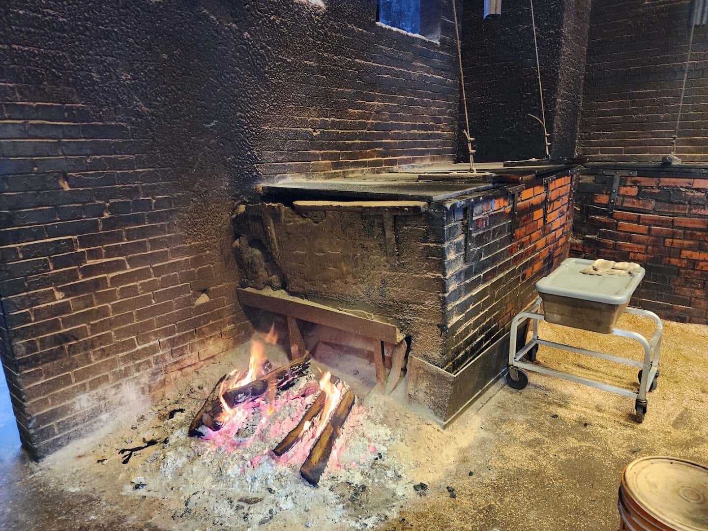 Live fire burning in the brick barbecue pit at Smitty's Market in Lockhart, Texas
