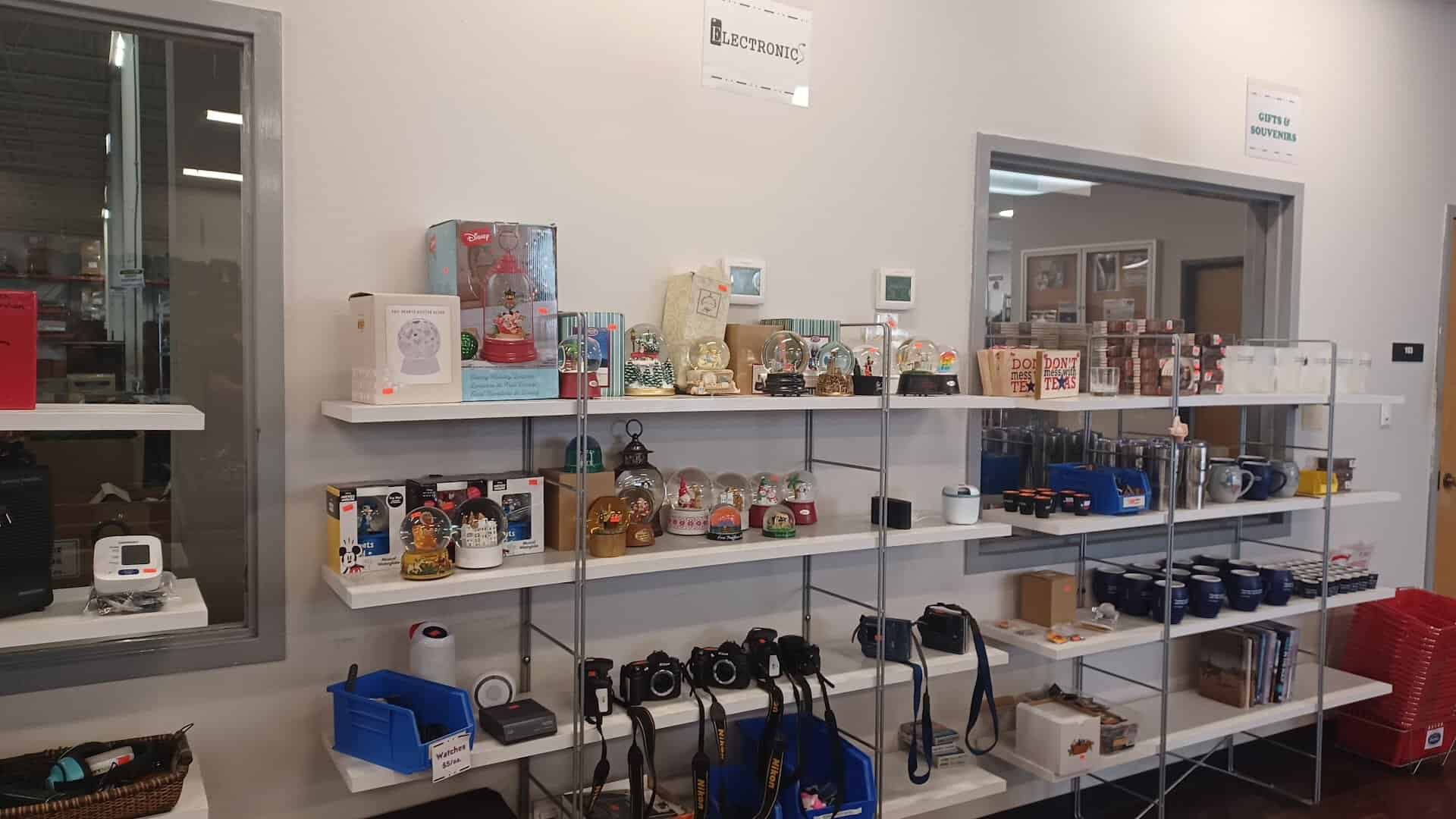 Shelves of snow globes, cameras and gifts at the State Surplus Store in Austin