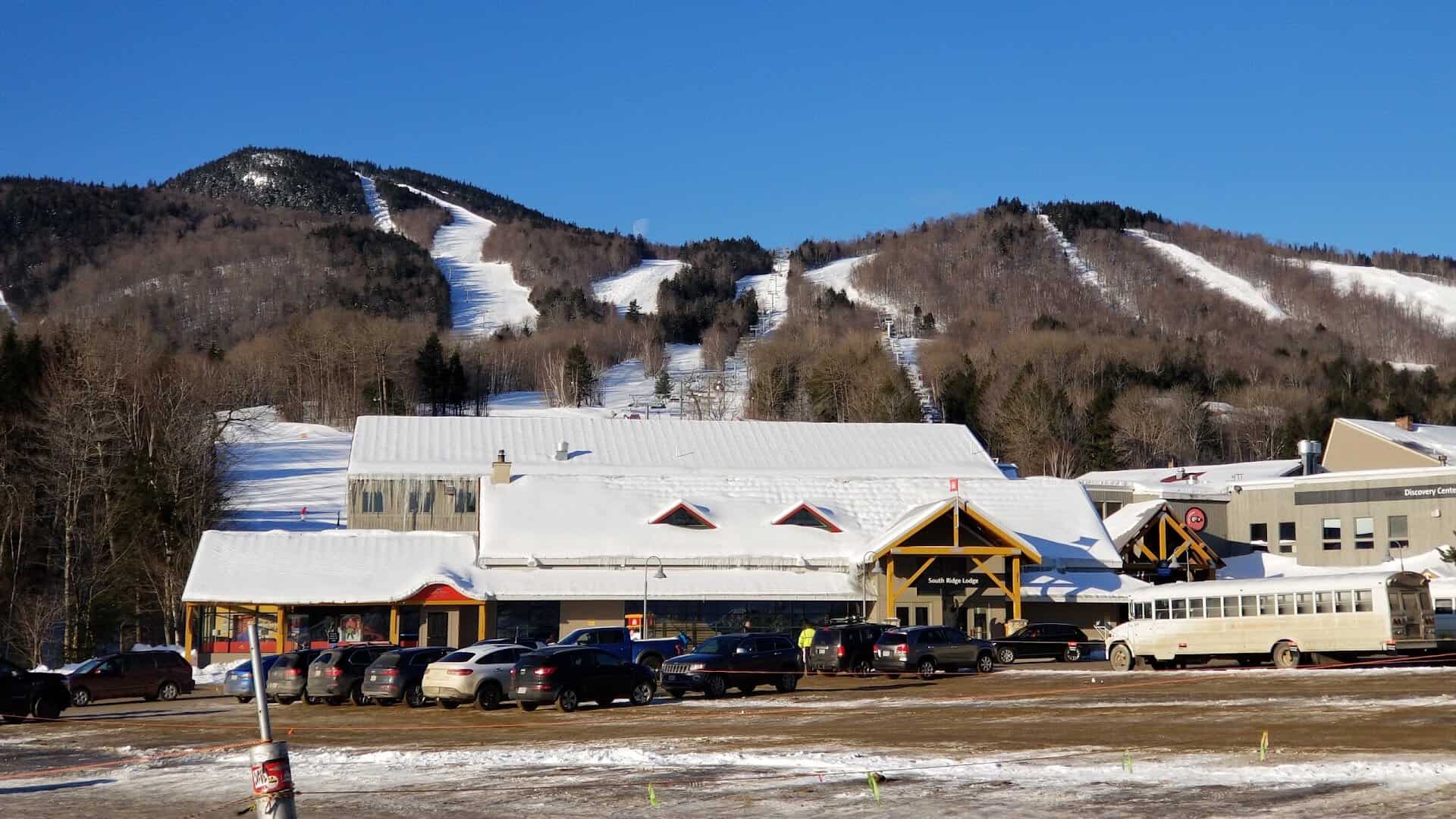 The snow-covered base lodge and ski trails at Sunday River near Bethel, Maine