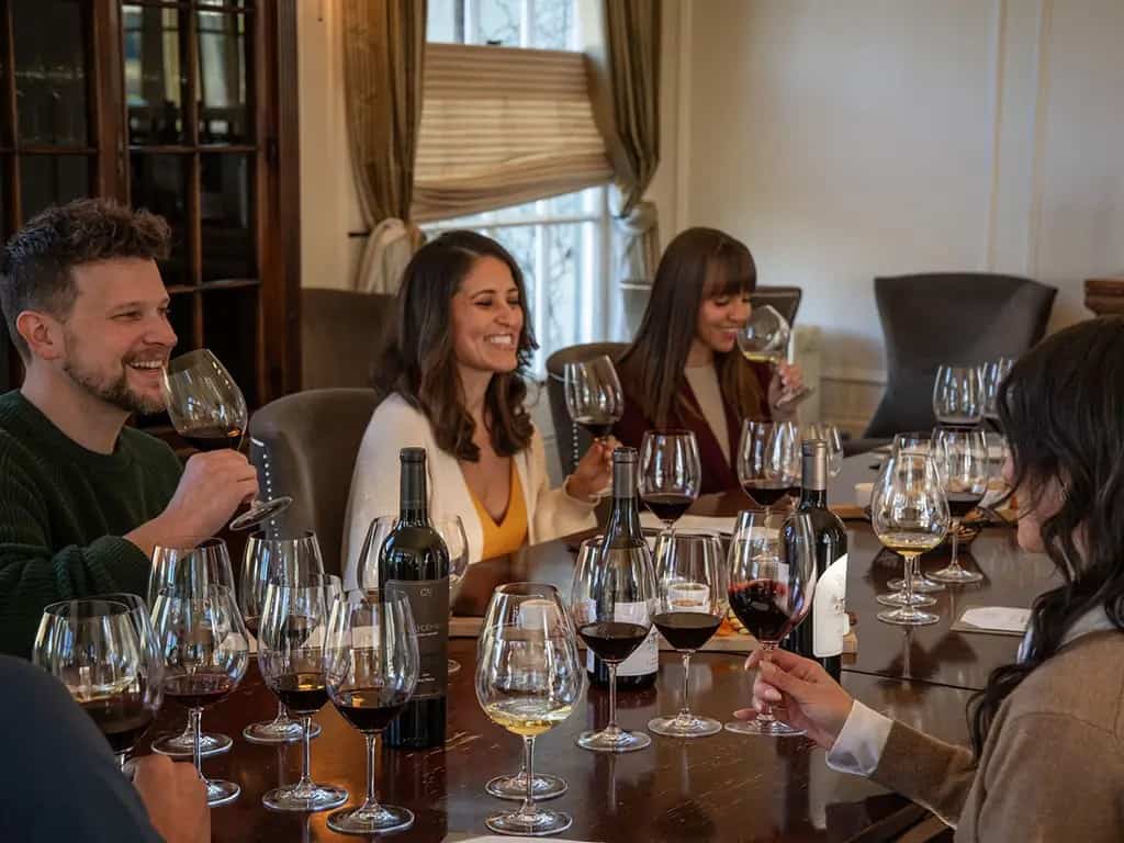 Friends wine tasting together at Chateau St. Jean in Sonoma County, California