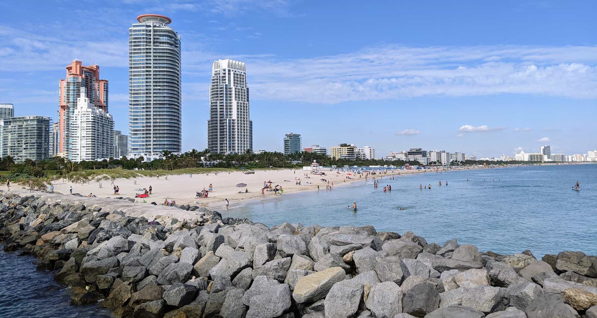 South Beach sand, turquoise water and the skyline in Miami Beach, Florida