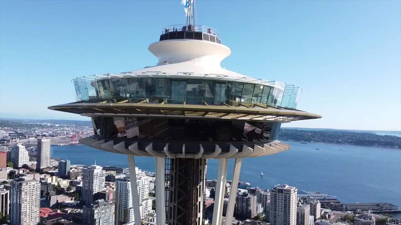 The Space Needle rising above Seattle, Washington with the bay behind