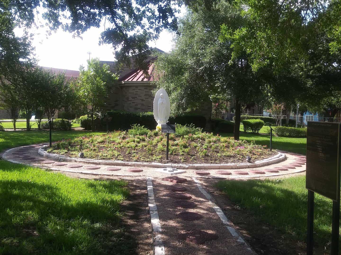 Brick path and grotto on the grounds of St. Anthony Catholic Church in Bryan