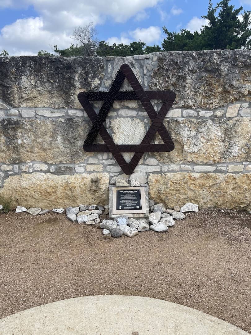 Star of David on a stone wall with prayer rocks at the Coming King Sculpture Prayer Garden