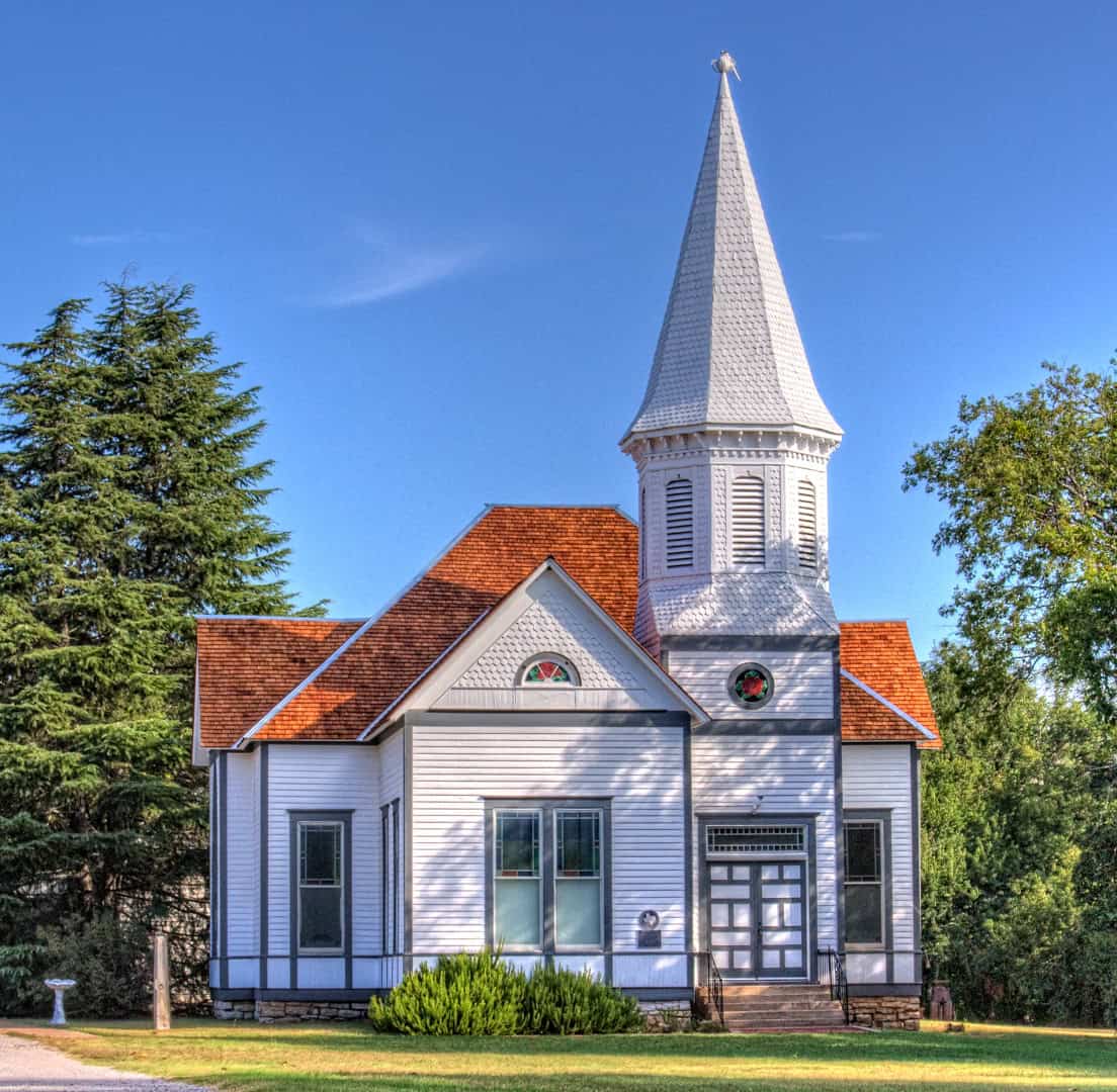 Historic white church with a steeple in Stephenville, Texas