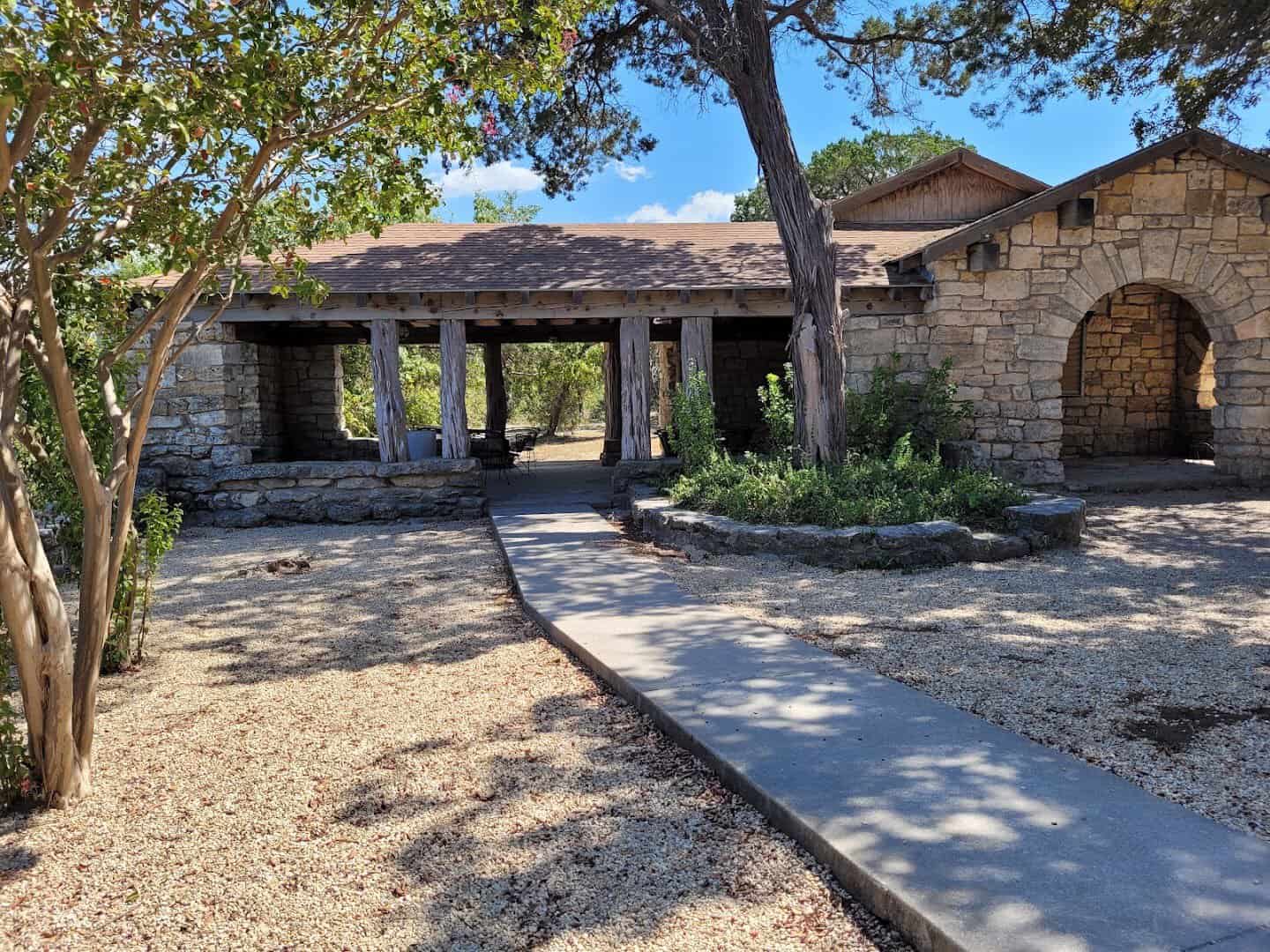 Stone pavilion and clubhouse built in the 1930s at Tonkawa Falls City Park in Crawford, Texas