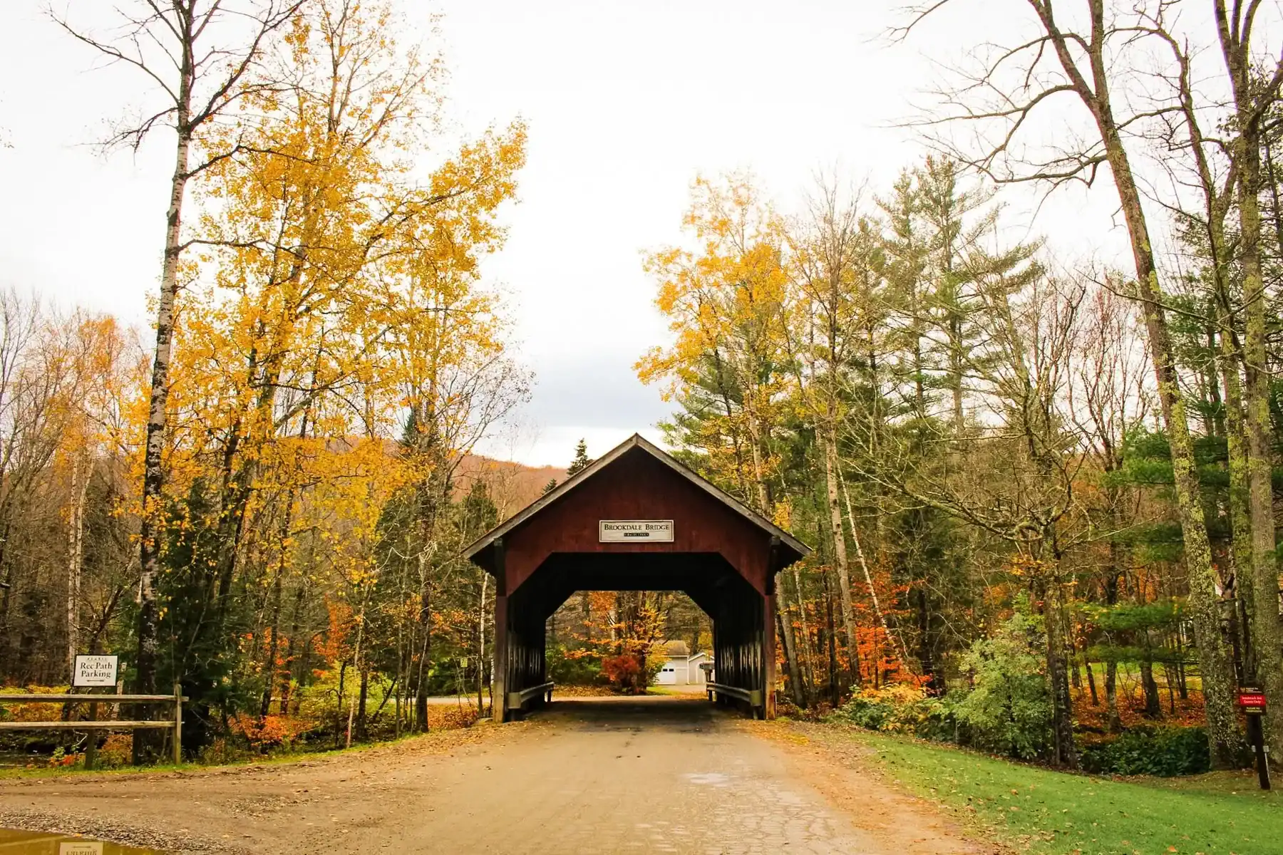 Covered bridge framed by autumn foliage, Stowe, Vermont