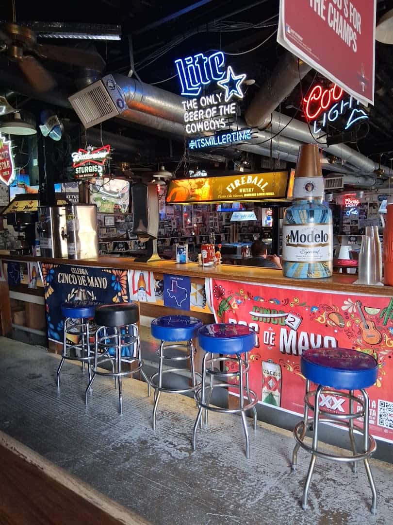 Bar counter and stools at Strokers Ice House in Dallas