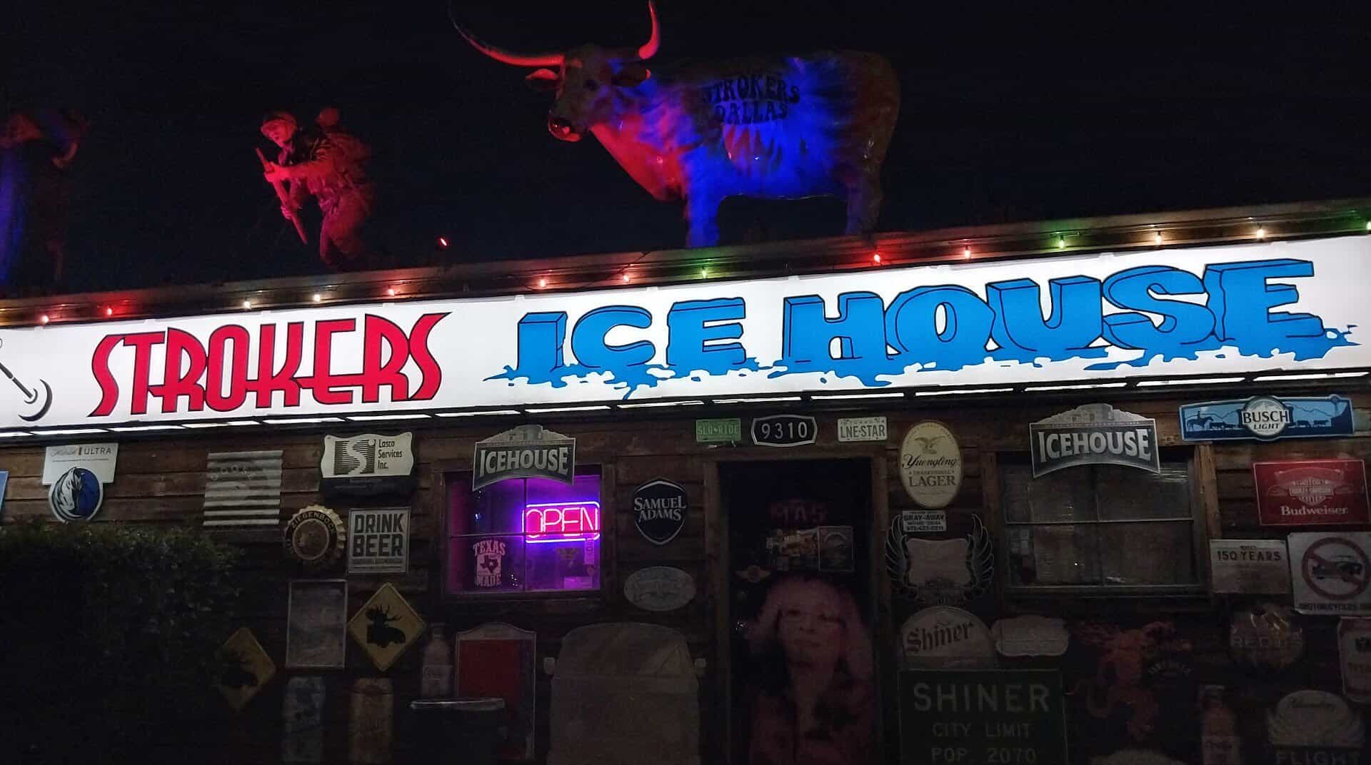 Neon Strokers Ice House sign lit up at night in Dallas