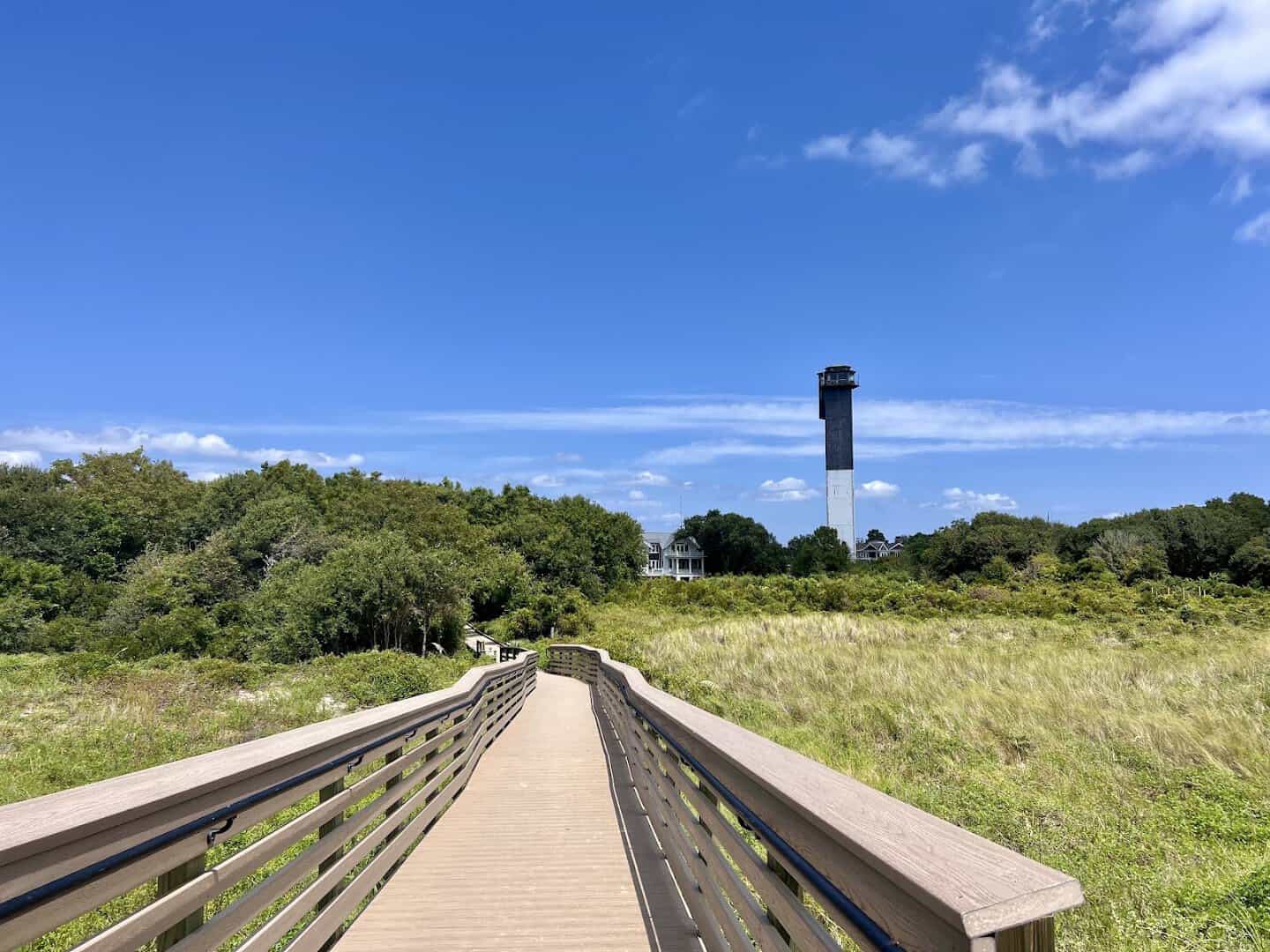 The triangular Sullivan's Island Lighthouse seen from the beach boardwalk near Charleston, SC