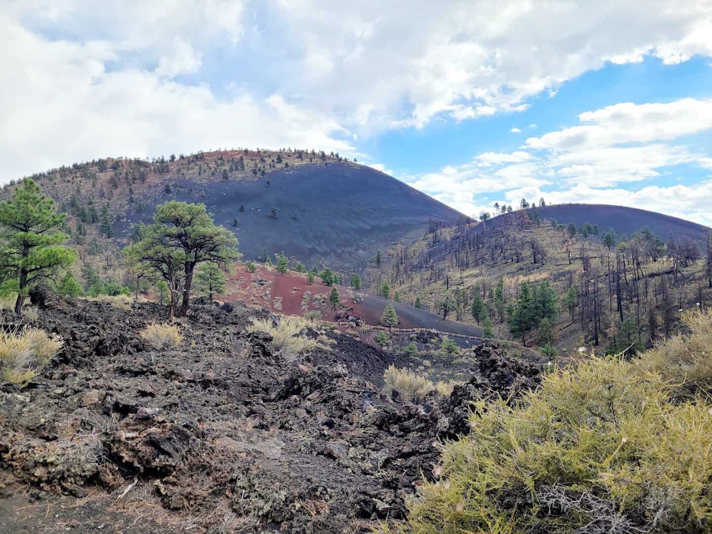 Black lava flow and cinder cone at Sunset Crater Volcano National Monument, Arizona