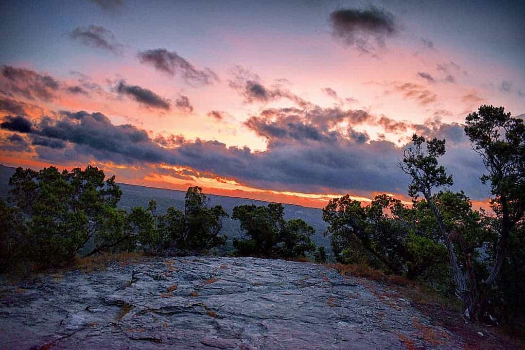 Sunset over the rocky summit of Old Baldy in Wimberley