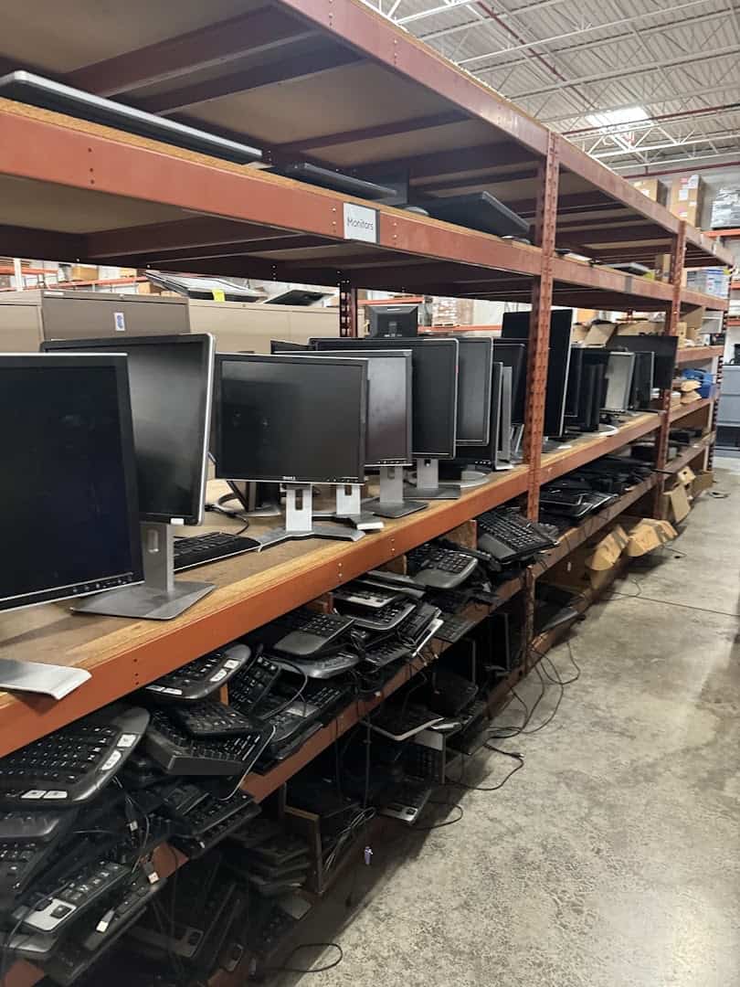 Shelves of surplus computer monitors at the State Surplus Store in Austin
