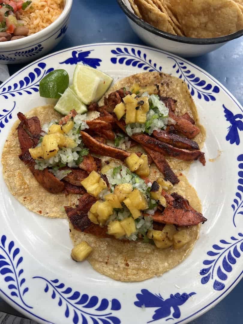 Tacos al pastor with pineapple at La Gloria in San Antonio