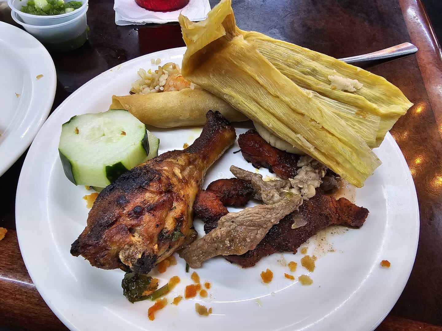 Buffet plate with a tamale, grilled chicken and steak at Ranchero King Buffet in Houston