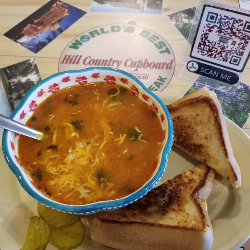 Bowl of hearty tortilla soup with grilled toast at Hill Country Cupboard