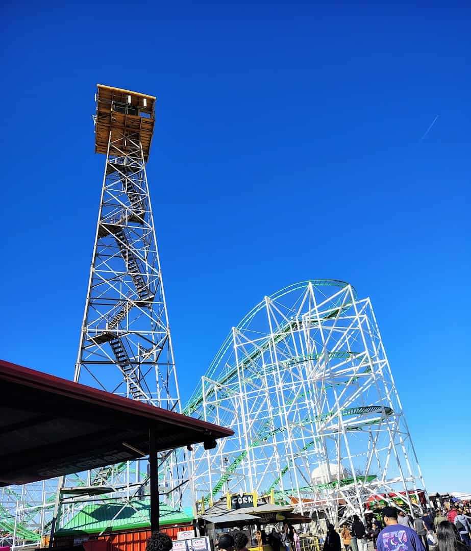Drop tower and wooden roller coaster at Traders Village in Grand Prairie, Texas