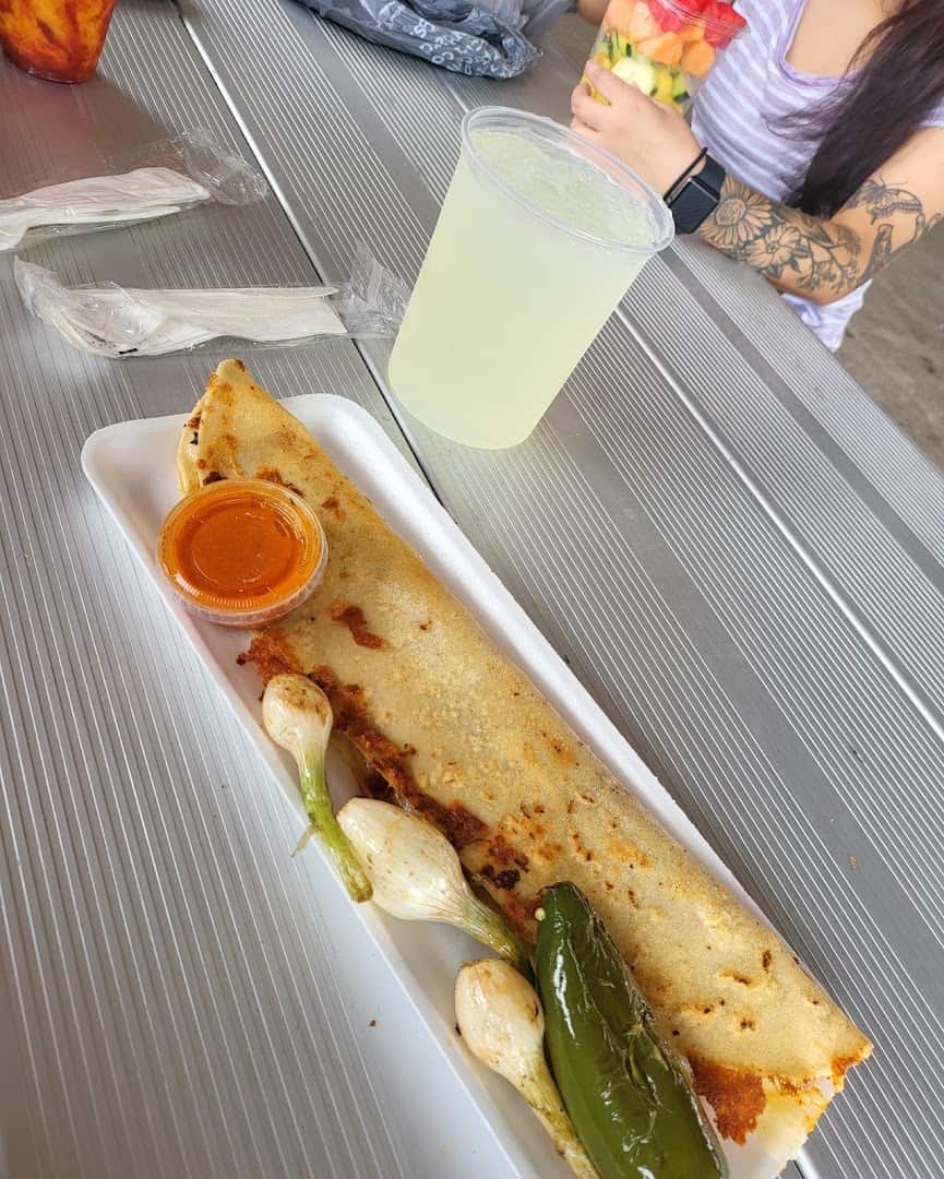 Grilled quesadilla plate with grilled onions and lemonade at Traders Village in Grand Prairie, Texas