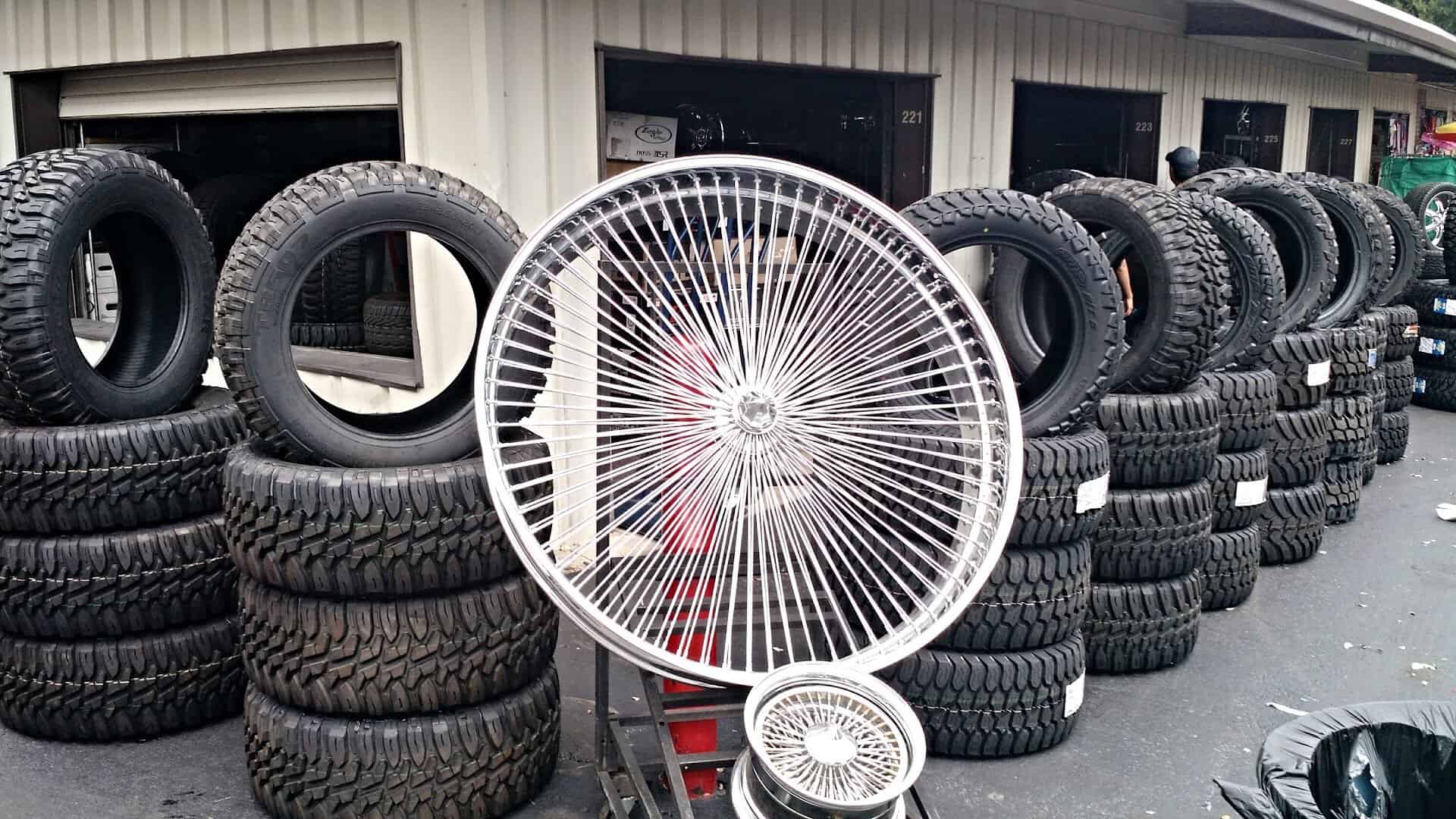 Tires and chrome wheels for sale at a Traders Village vendor in Grand Prairie, Texas