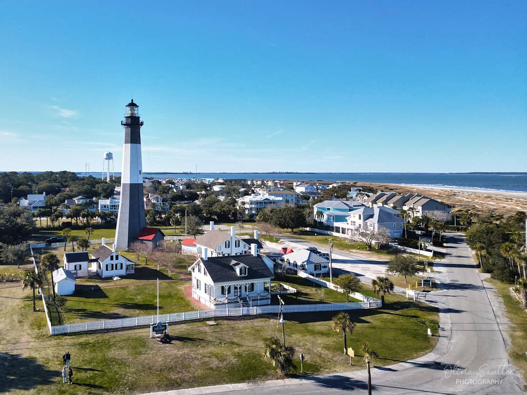 The black-and-white Tybee Island Light Station rising above the town in Georgia