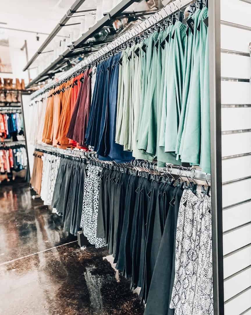 Racks of colorful secondhand clothing at Uptown Cheapskate Tyler
