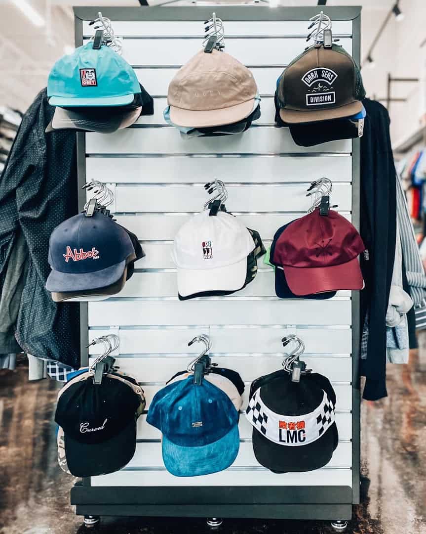 Wall display of hats and caps at Uptown Cheapskate Tyler