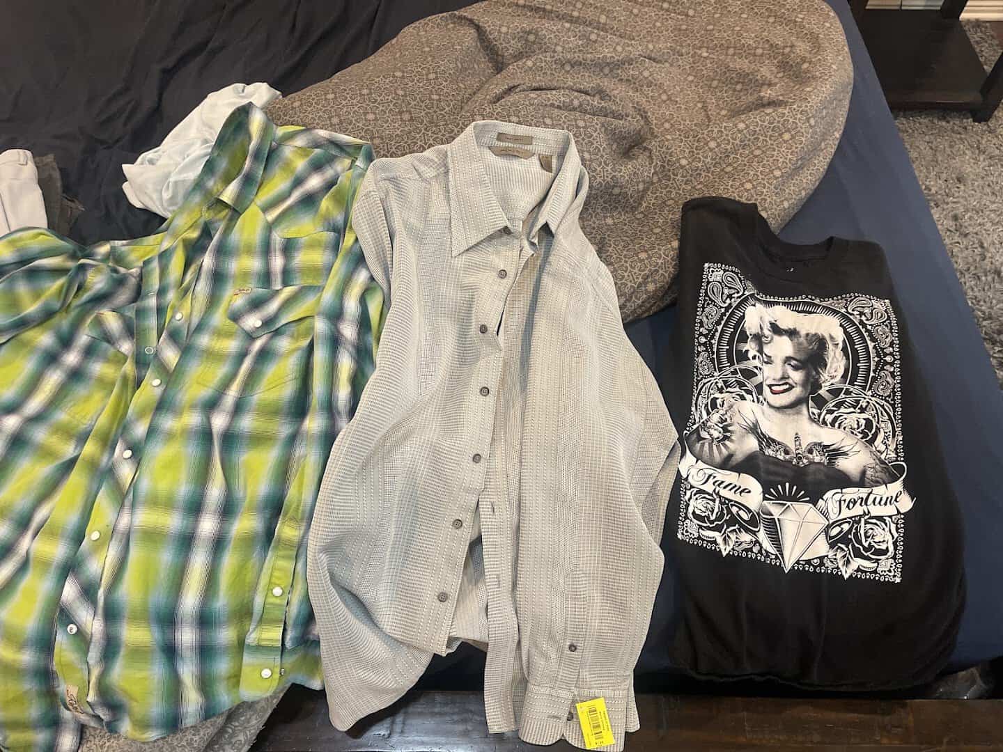 Vintage plaid shirts and a graphic tee at Uptown Cheapskate Tyler
