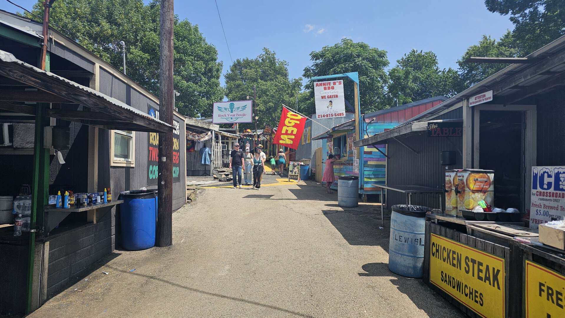 Vendor lane lined with food stands at First Monday Trade Days in Canton