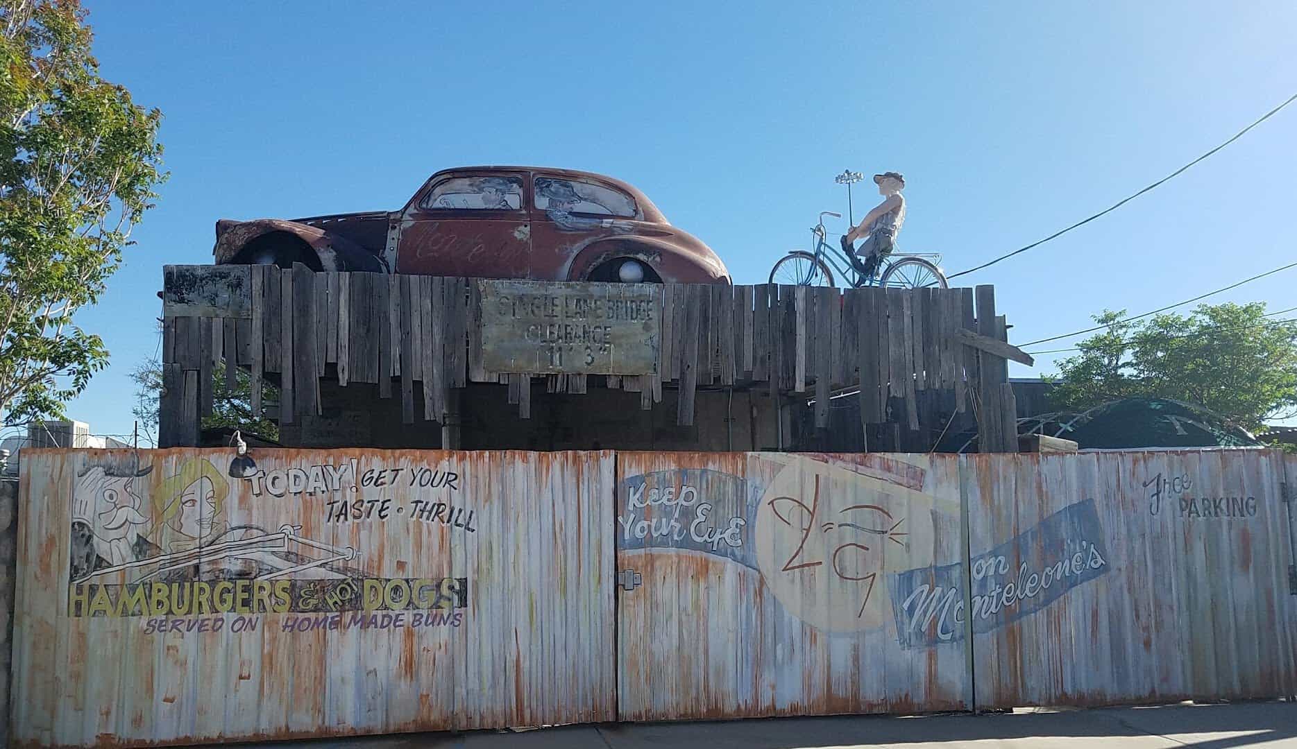 Vintage car and painted wall beside the old building at Monteleone's Italian Ristorante in El Paso