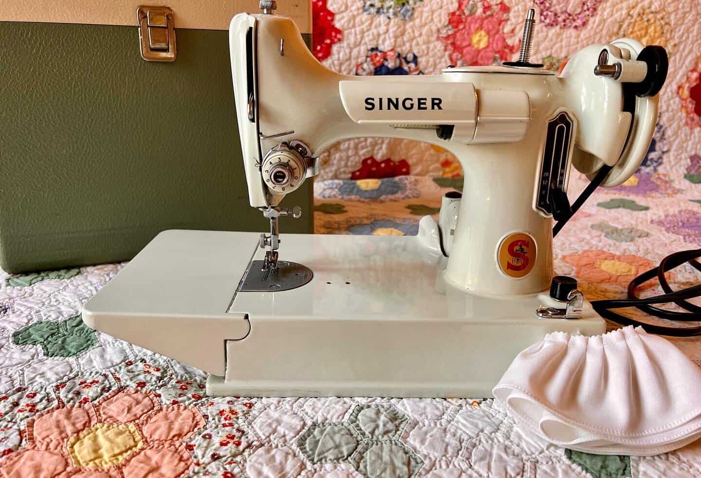 Vintage Singer sewing machine with fabric at The Quilted Skein in La Grange, Texas