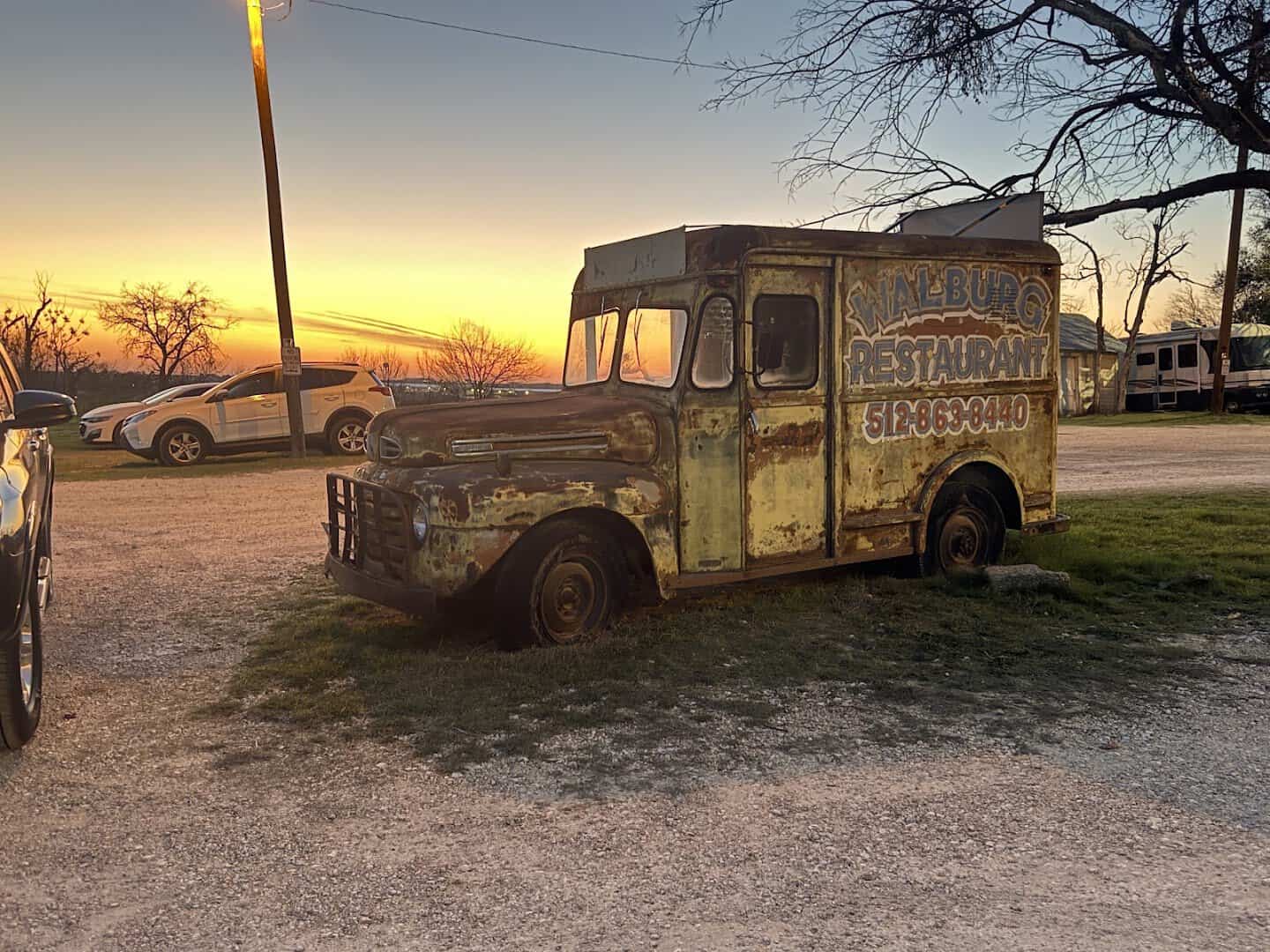 Vintage Walburg Restaurant delivery truck at sunset outside the restaurant