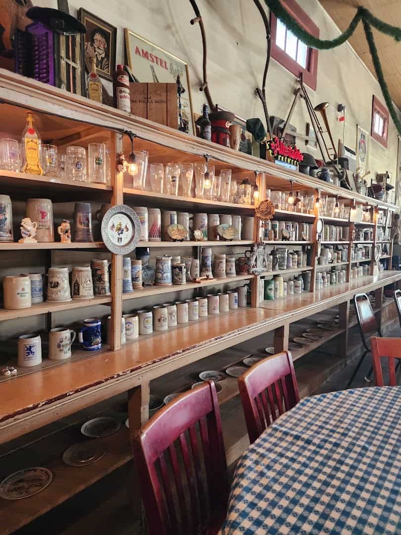 Wall of German beer steins inside Walburg German Restaurant